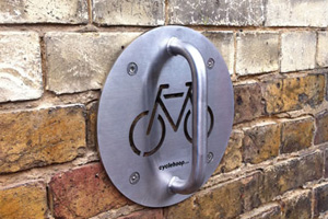 An attached Cyclehoop Wall Anchor in stainless steel