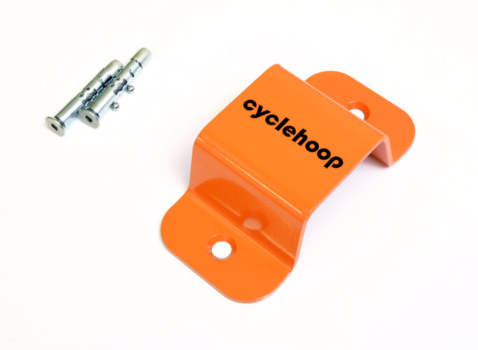 Close up of a Cyclehoop Mini Wall Anchor in orange