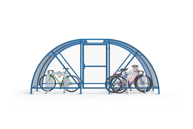 Bikes parked against racks inside a large, dome-roofed clear compound with a blue frame.