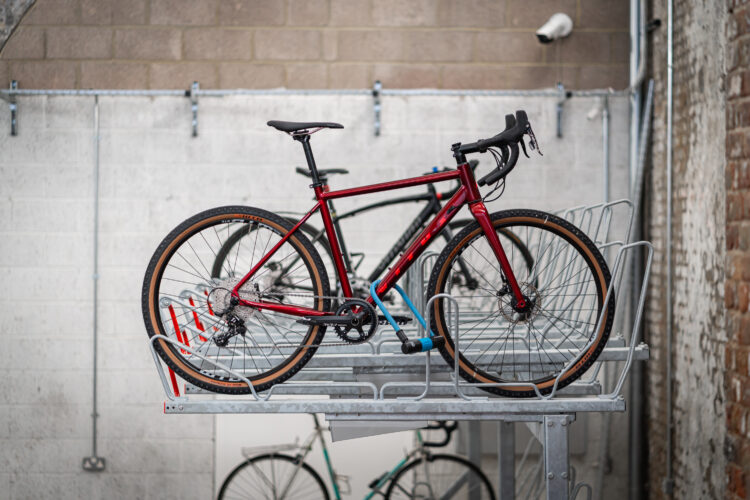 Two rows of bicycles stored on a double-layer bike storage rack.
