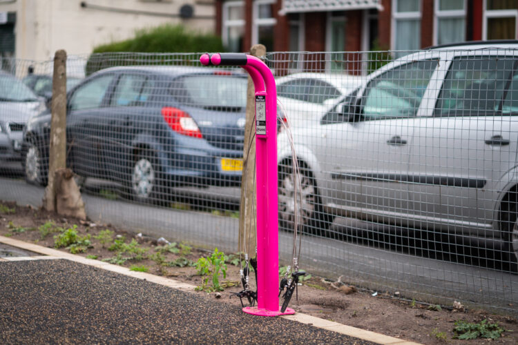 A pink Cyclehoop public repair stand