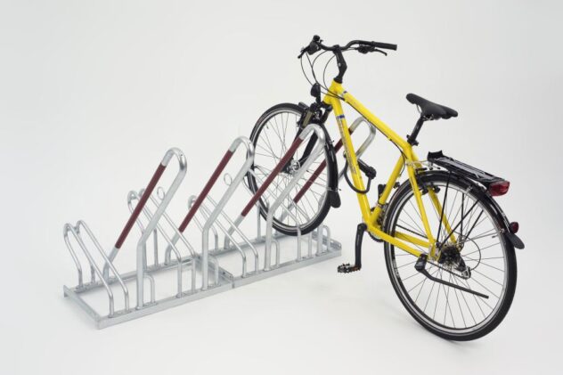 Isometric view of a silver Cyclehoop high density cycle rack with one bicycle attached