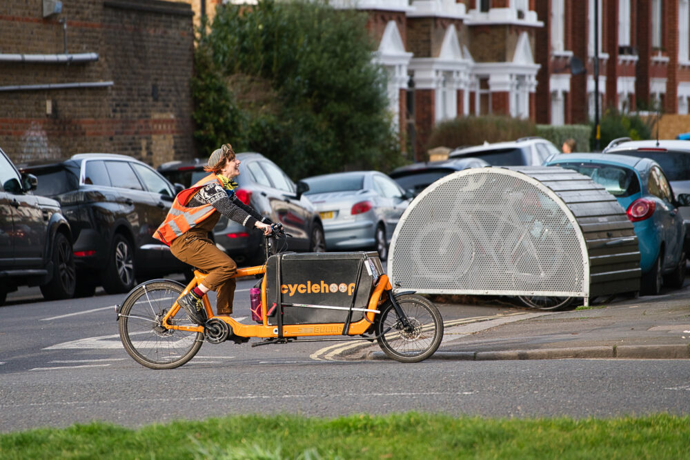 Woman rides maintenance cargo bike