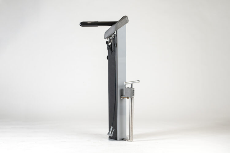 A tall, metal, cylindrical Public Bike Repair stand with a pump attached.