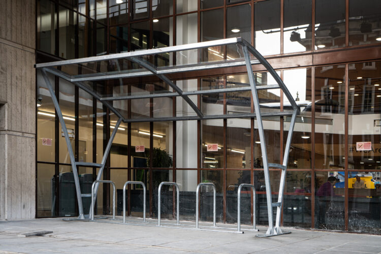 A cycle storage area installed adjacent to a large building